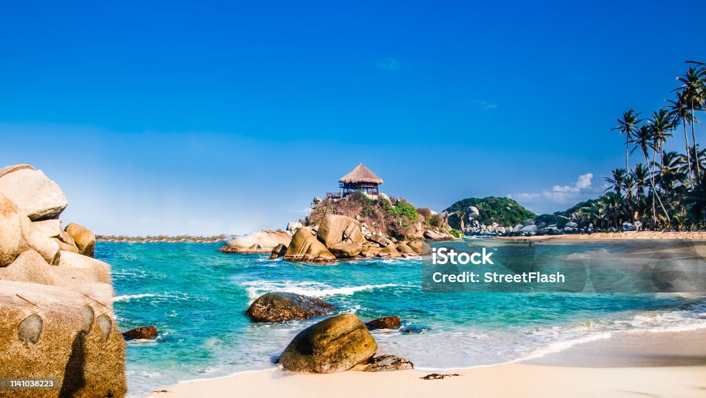 Beautiful bay with white sand beach and blue water in Tayrona national park in Colombia Viewn on beautiful bay with white sand beach and blue water in Tayrona national park in Colombia Colombia Stock Photo