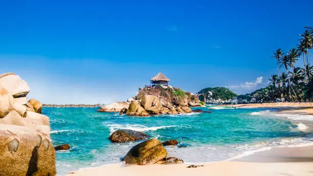 Viewn on beautiful bay with white sand beach and blue water in Tayrona national park in Colombia