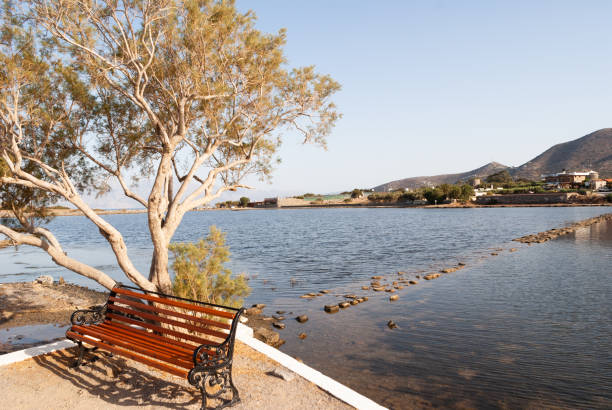 istock Bench in front of water 1141038771