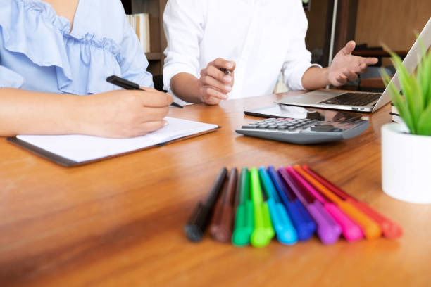 istock Tutor, learning, education, Group of young people learning studying lesson in library during helping teaching friend education prepare for exam, youth campus friendship teenager teens concept 1141040750