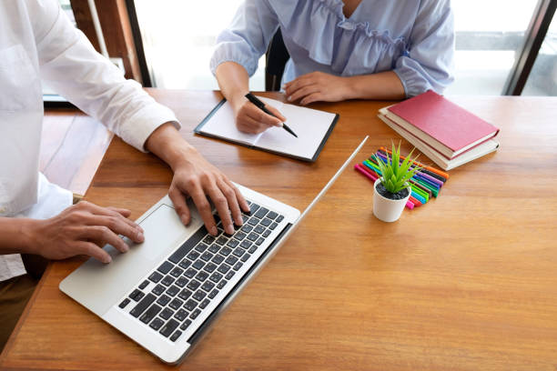 istock Group of young people learning studying lesson in library during helping teaching friend education prepare for exam, youth campus friendship teenager teens concept 1141040833