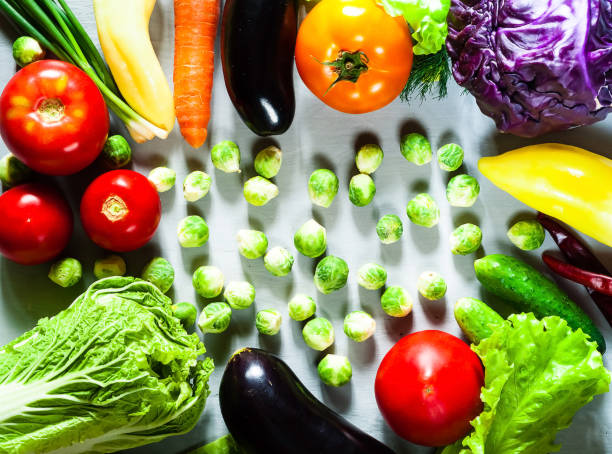 istock Fresh vegetables for healthy cooking on light wooden background. 1141041652