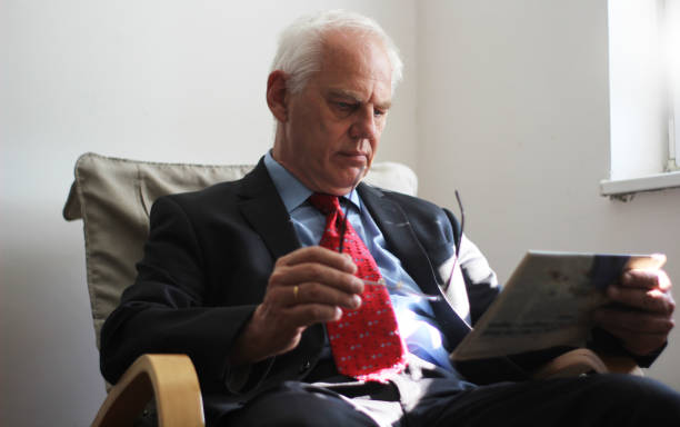 istock Mature businessman with newspaper 1141044711
