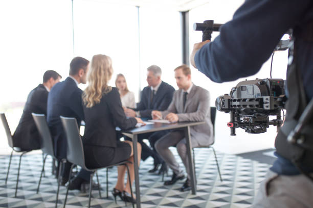 istock Videographer filming business meeting 1141044830