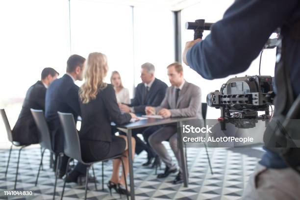 Videographer Filming Business Meeting Stock Photo - Download Image Now - Movie, Corporate Business, Filming