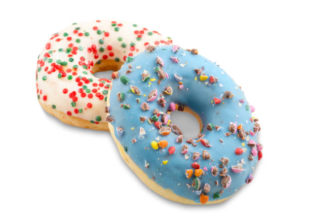 istock Donuts decorated in colors and chocolate chips. Isolated white background 1141044851