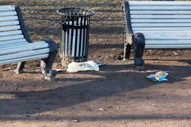 istock garbage near an urn in a city park 1141047147