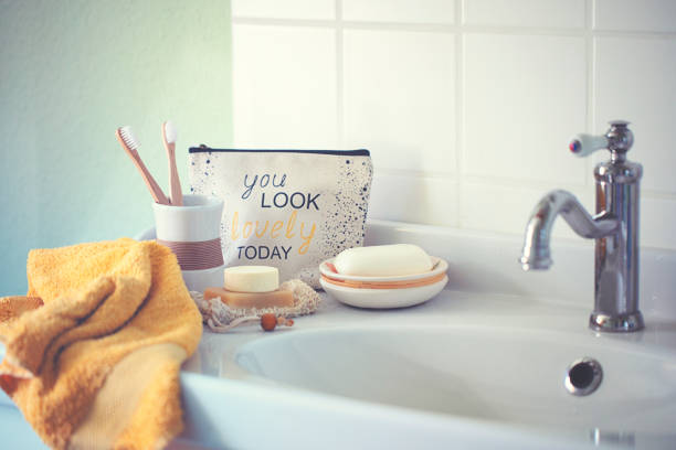 Morning toilet in the bathroom with wooden toothbrushes and cosmetic bag with a cheerful saying Morning toilet in the bathroom with wooden toothbrushes and cosmetic bag with a cheerful saying make up bag stock pictures, royalty-free photos & images