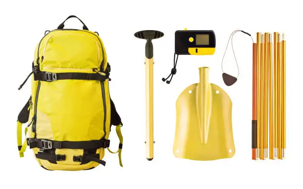 Set of avalanche equipment and gear for freeride. Backpack, shovel, probe and transceiver isolated on white background