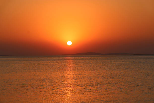 istock Sunset above sea. Beautiful summer decline above ocean 1141048798