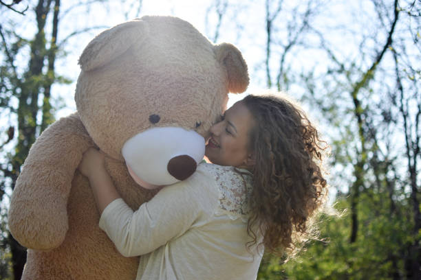 istock Woman with bear toy 1141048930
