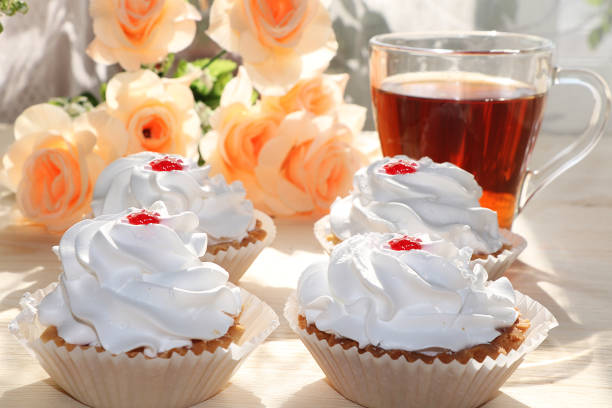 A cup of tea and a cake on a sunny table, a bouquet of spring flowers for mood, diet food and a healthy lifestyle in the village, a beautiful morning in the village, a delicious dessert