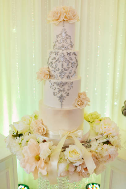istock White wedding cake with flowers and blueberries. Vintage style for weddings. 1141051002