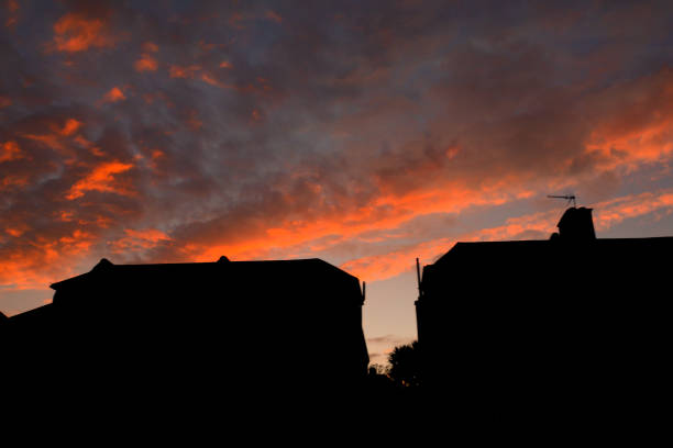 istock Sunset over residential houses 1141051358