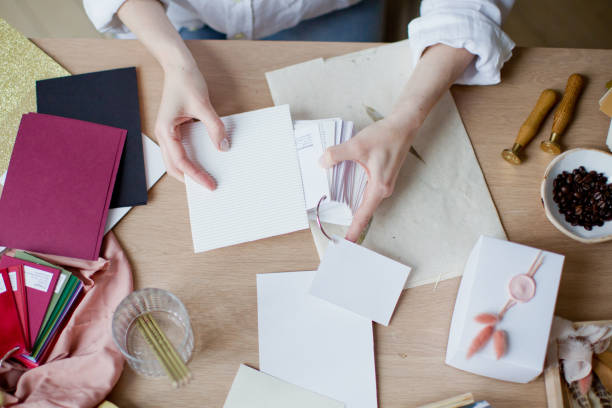 istock Woman at workplace choosing colourful paper charts 1141051483