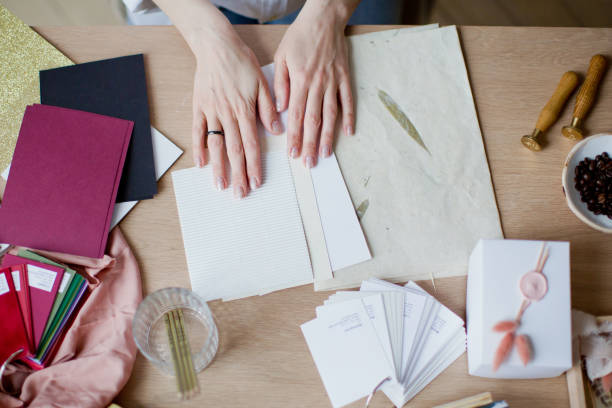 istock Woman at workplace choosing colourful paper charts 1141051486