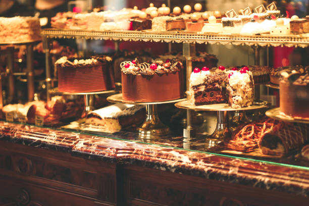 istock Pastry shop display window with variety of cakes 1141052219