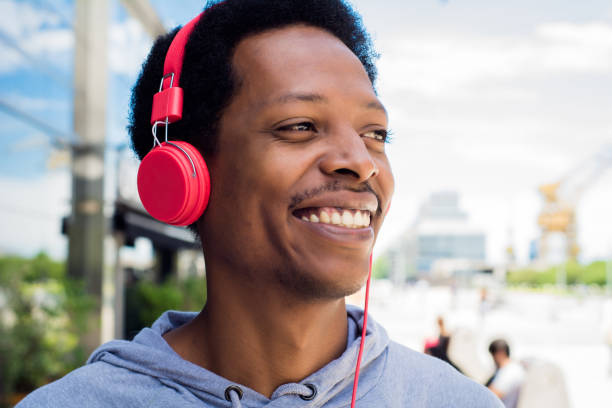 istock Young man enjoying music outdoor. 1141052635
