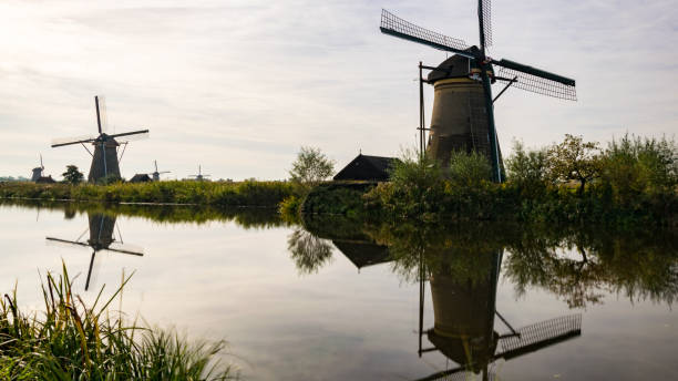 istock windmill farm river landscape dutch windmill farm scene netherland 1141053801