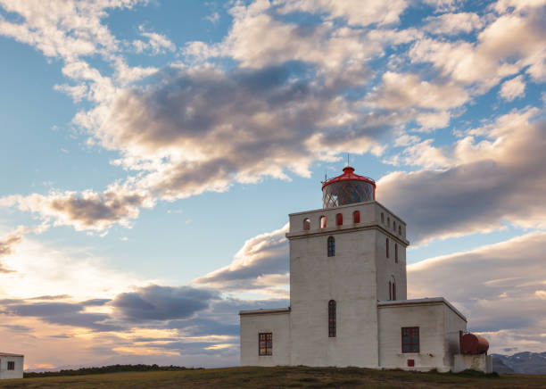 istock Dyrholaey lighthouse at sunset Vik South coast of Iceland 1141056877