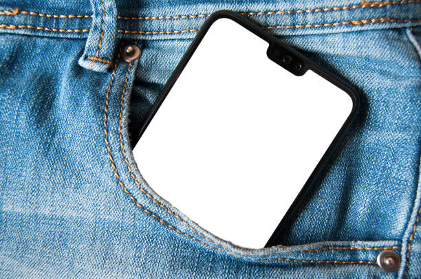 istock Smartphone with isolated white screen in a denim jeans pocket 1141057158