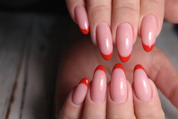 istock Partial view of manicurist gently holding hand 1141058842