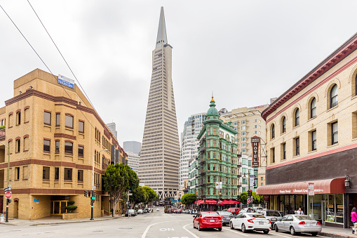 SEPTEMBER 3, 2016 - SAN FRANCISCO: Central San Francisco with famous Transamerica Pyramid and historic Sentinel Building at Columbus Avenue on a cloudy day, California, USA