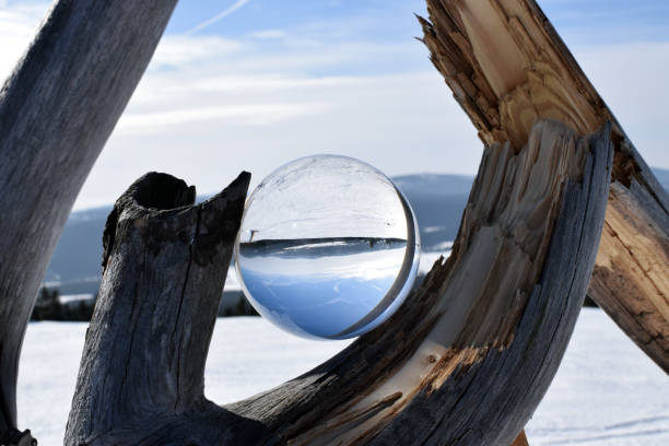istock Winter mountain landscape in crystal ball. 1141060935