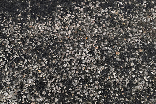 asphalt road surface, pitch and pebble stone,