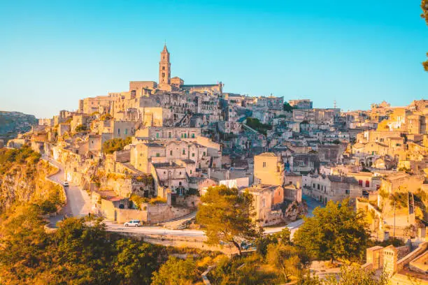 Panoramic view of the ancient town of Matera (Sassi di Matera) in beautiful golden morning light at sunrise, Basilicata, southern Italy