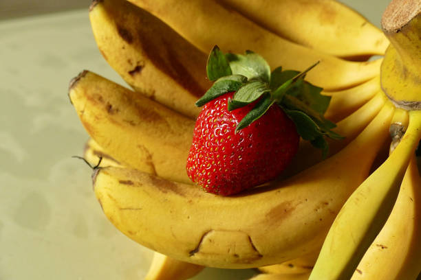 organic banana and strawberry in the same area,