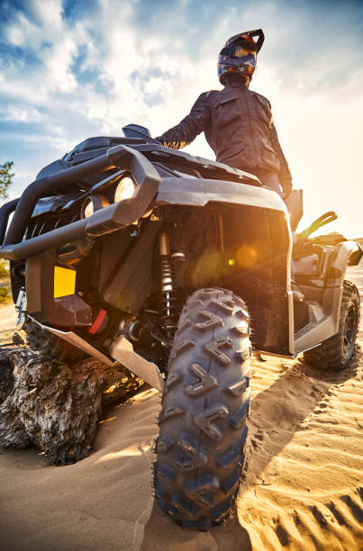 istock Racing in the sand on a four-wheel drive quad. 1141064070
