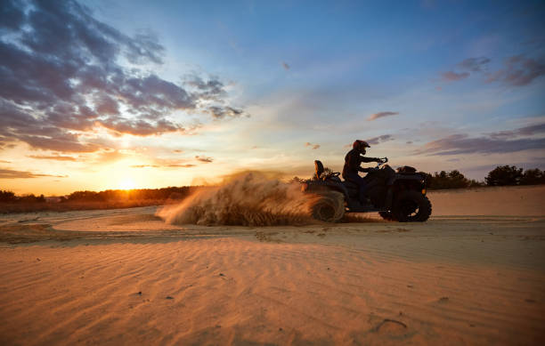 istock Racing in the sand on a four-wheel drive quad. 1141064072