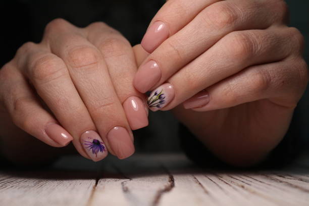 istock Partial view of manicurist gently holding hand 1141066721