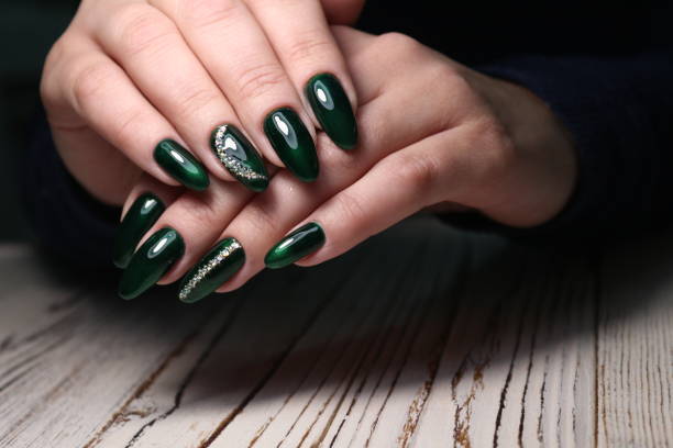 istock Beautiful woman's nails with beautiful christmas manicure 1141066795