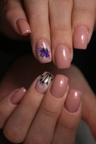 istock Partial view of manicurist gently holding hand 1141067134