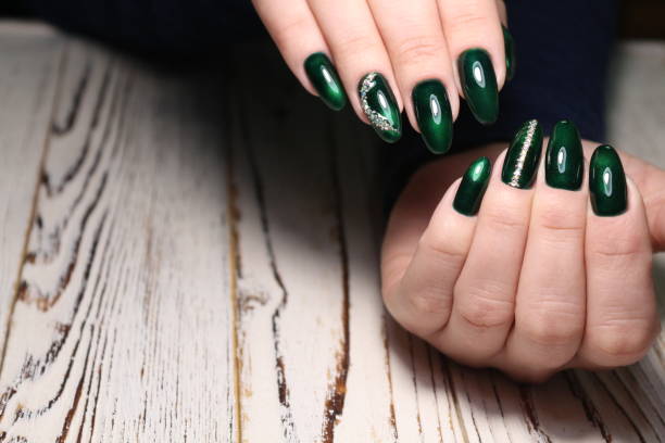 istock Beautiful woman's nails with beautiful christmas manicure 1141068358