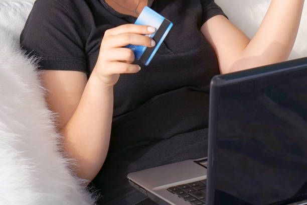 istock the girl is shopping online. 1141068452