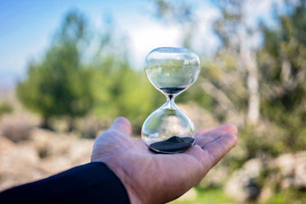 istock Time is up. Hourglass in hand. 1141075631