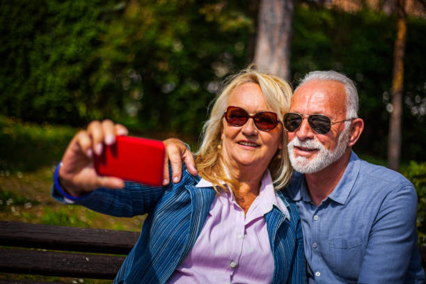 istock Senior couple enjoy in park 1141078744