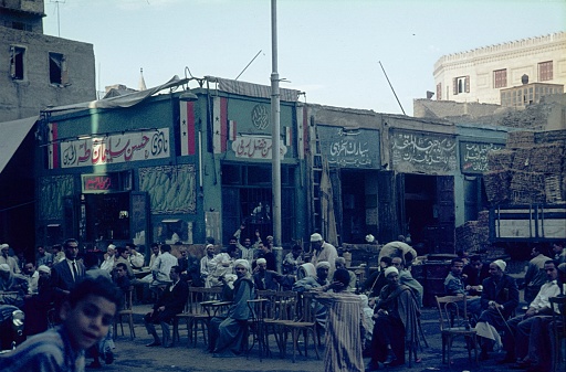 Cairo, Egypt, 1964. Coffeehouse with outside terrace and guests in a street in the oldest existing city in the World: Cairo.