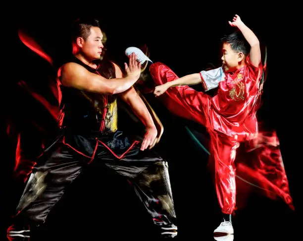 Photo of wushu chinese boxing kung fu Hung Gar fighter isolated child