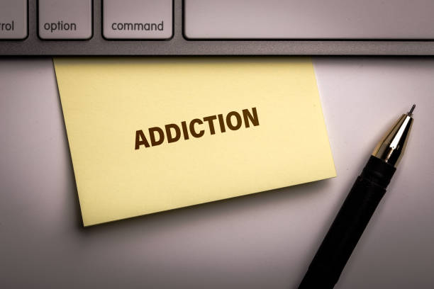 istock Addiction word write on the paper 1141083828
