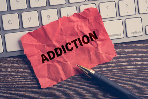 istock Addiction word write on the paper 1141083870
