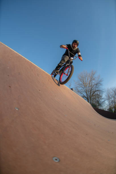 istock BMX trick in a wooden ramp 1141086573