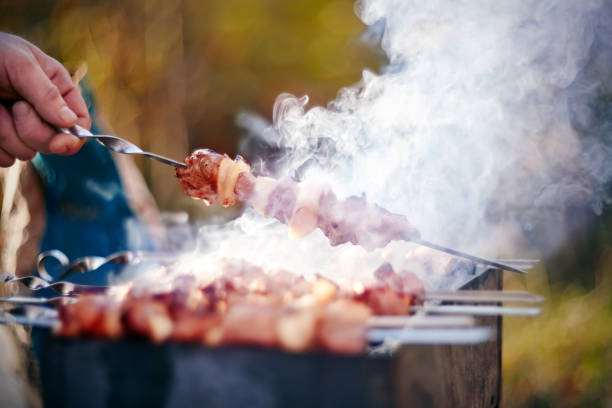 istock Smoky grilling the marinated pork meat shashlik. 1141086681