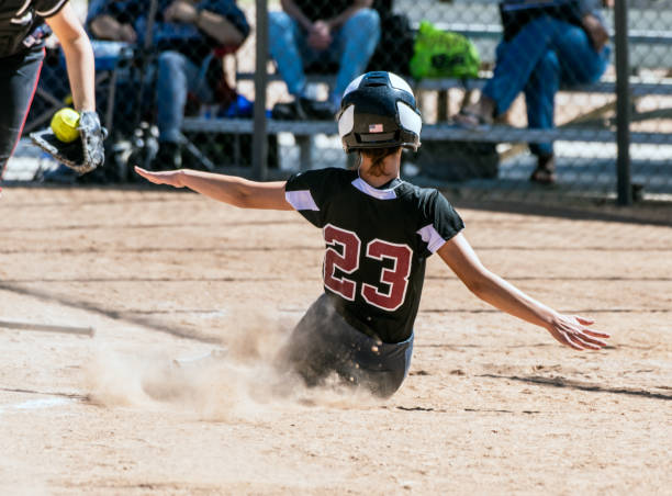 istock Fastpitch softball player focused on the game. 1141088619