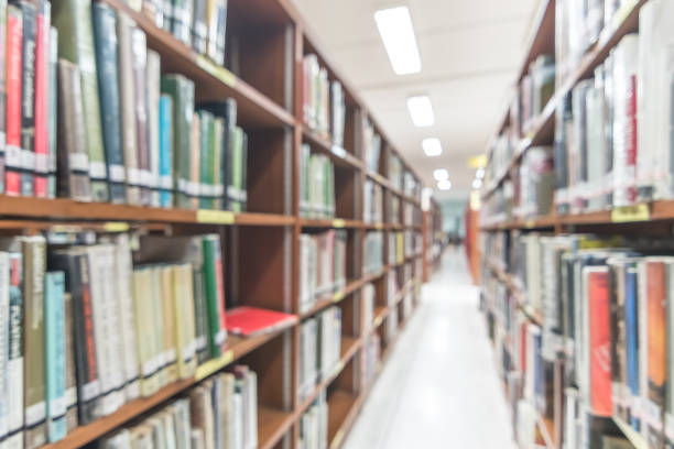 istock Blur school library or study room with book shelves for education background 1141093498