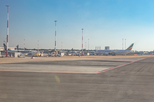 Parked planes on the airfield in Fiumicino International Airport \