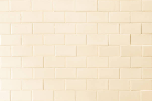 istock Porcelain tile texture patterned wall background white cream beige color 1141093743